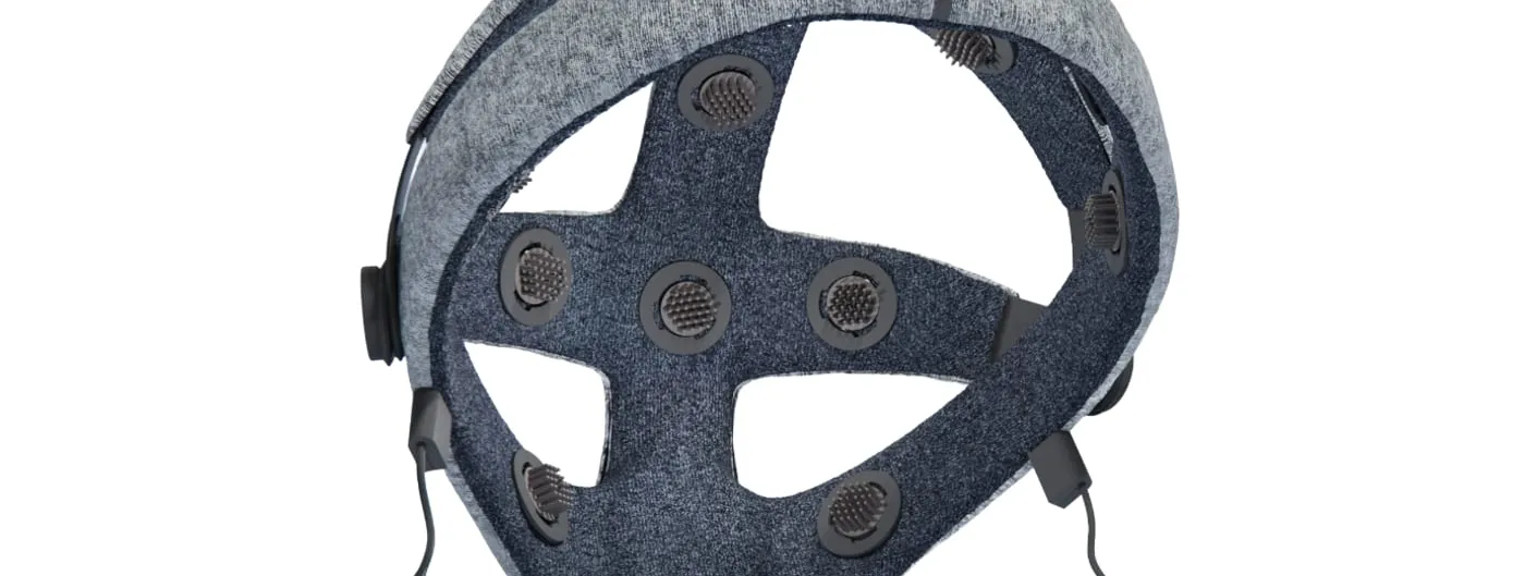 The underside of the Cumulus Neuroscience NeuLogiq dry-sensor EEG headset, showing its grey fabric headband and sixteen dark circular electrode contacts on a cross-shaped internal frame.