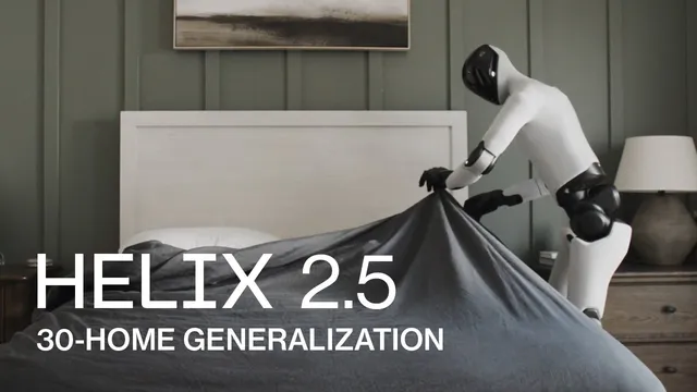 A white and black humanoid robot leans across a bed in a green-panelled bedroom, gripping a grey duvet and pulling it over the mattress.