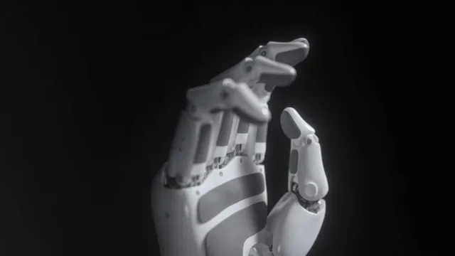 A close-up of Kinetix AI's KAI Hand, a multi-fingered dexterous robotic hand with articulated white and grey joints, held upright against a black background.